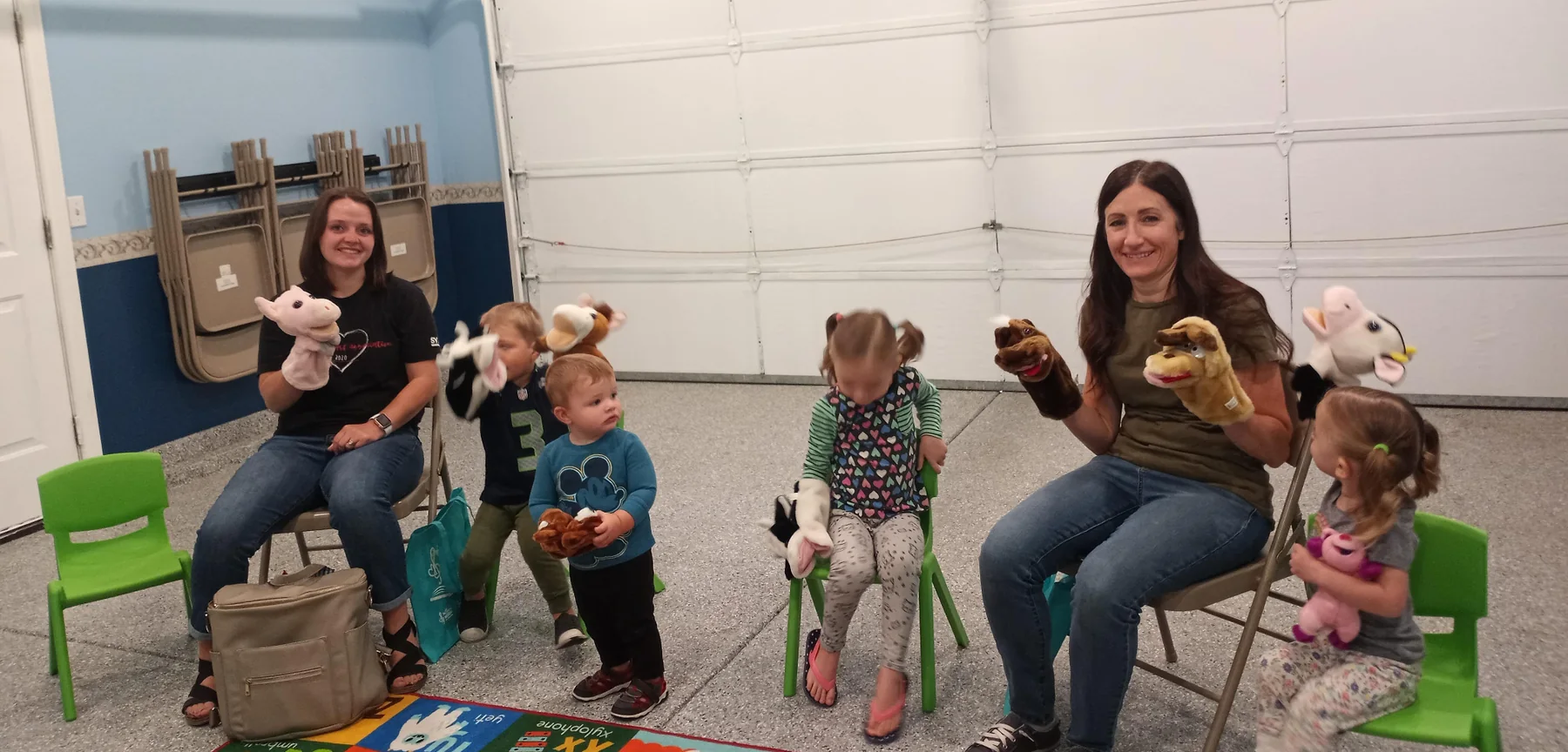Two families with their children in a Family Music class