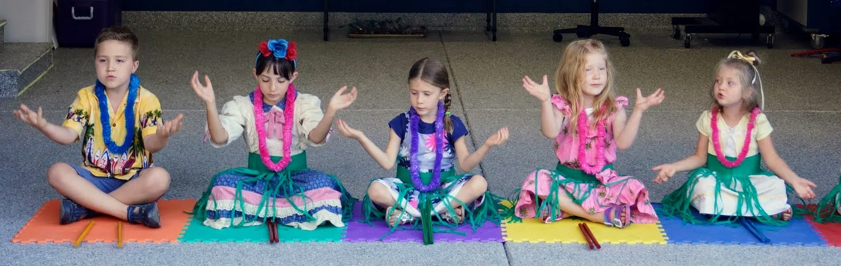 Music Adventures children seated together in a row