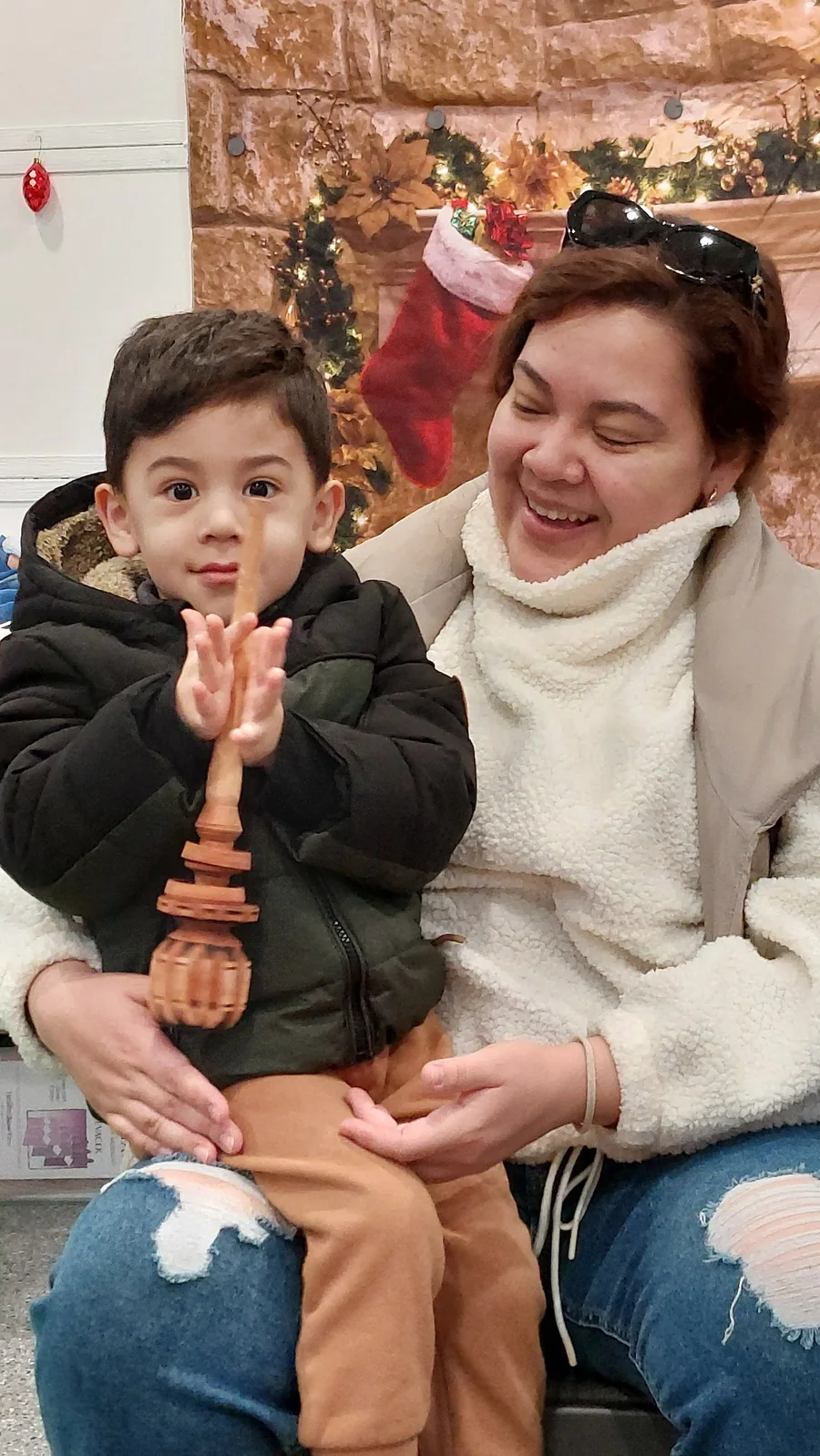 A parent and child making music together in class