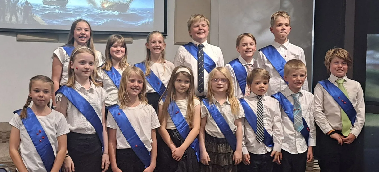 The children and youth choir in performance sashes